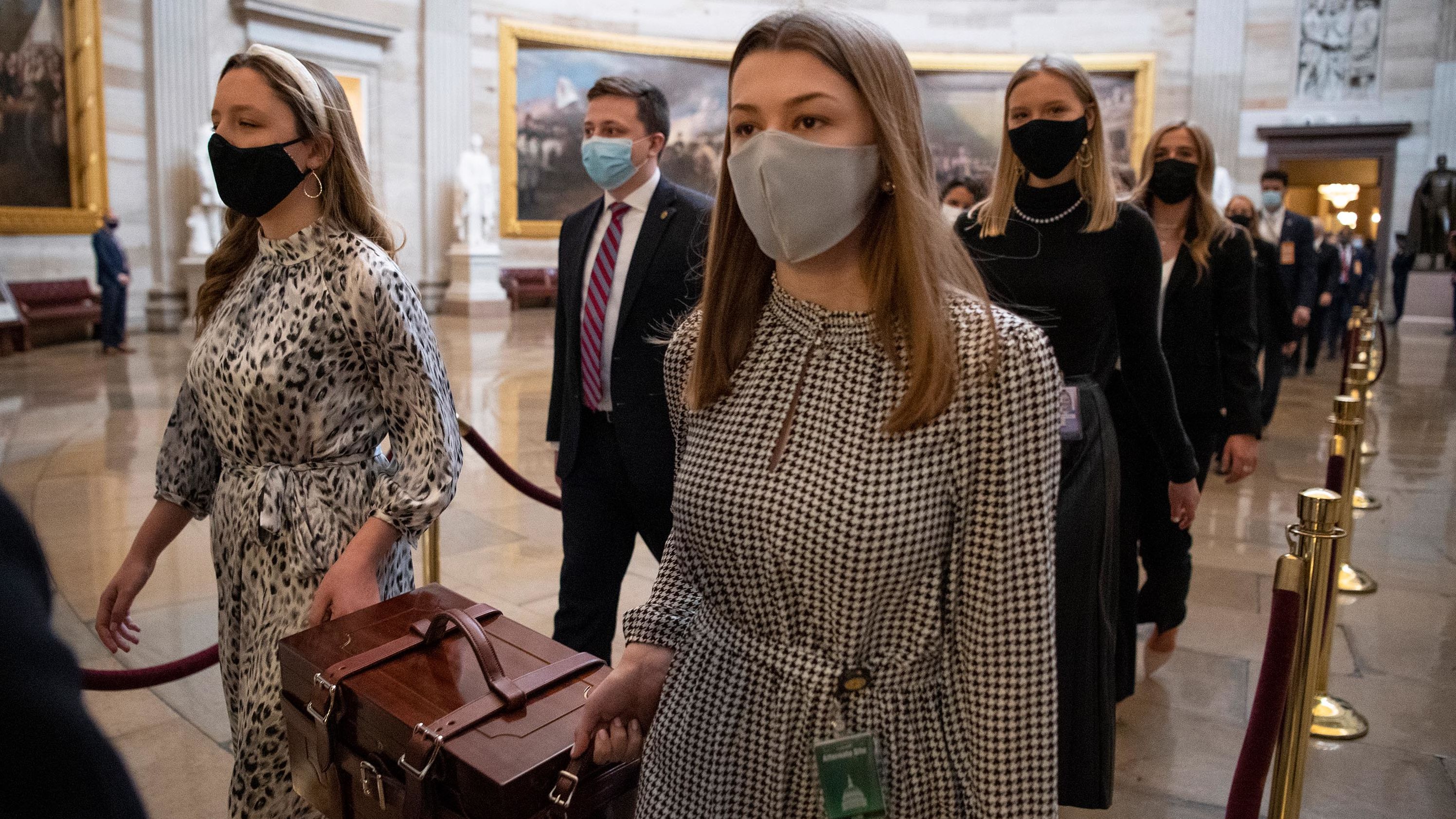 Chamber assistants carry Electoral College ballot boxes at the Capitol. Congress' counting of electoral votes is typically little more than an afterthought. But this joint session was expected to be a contentious affair with some Republicans objecting to the count.