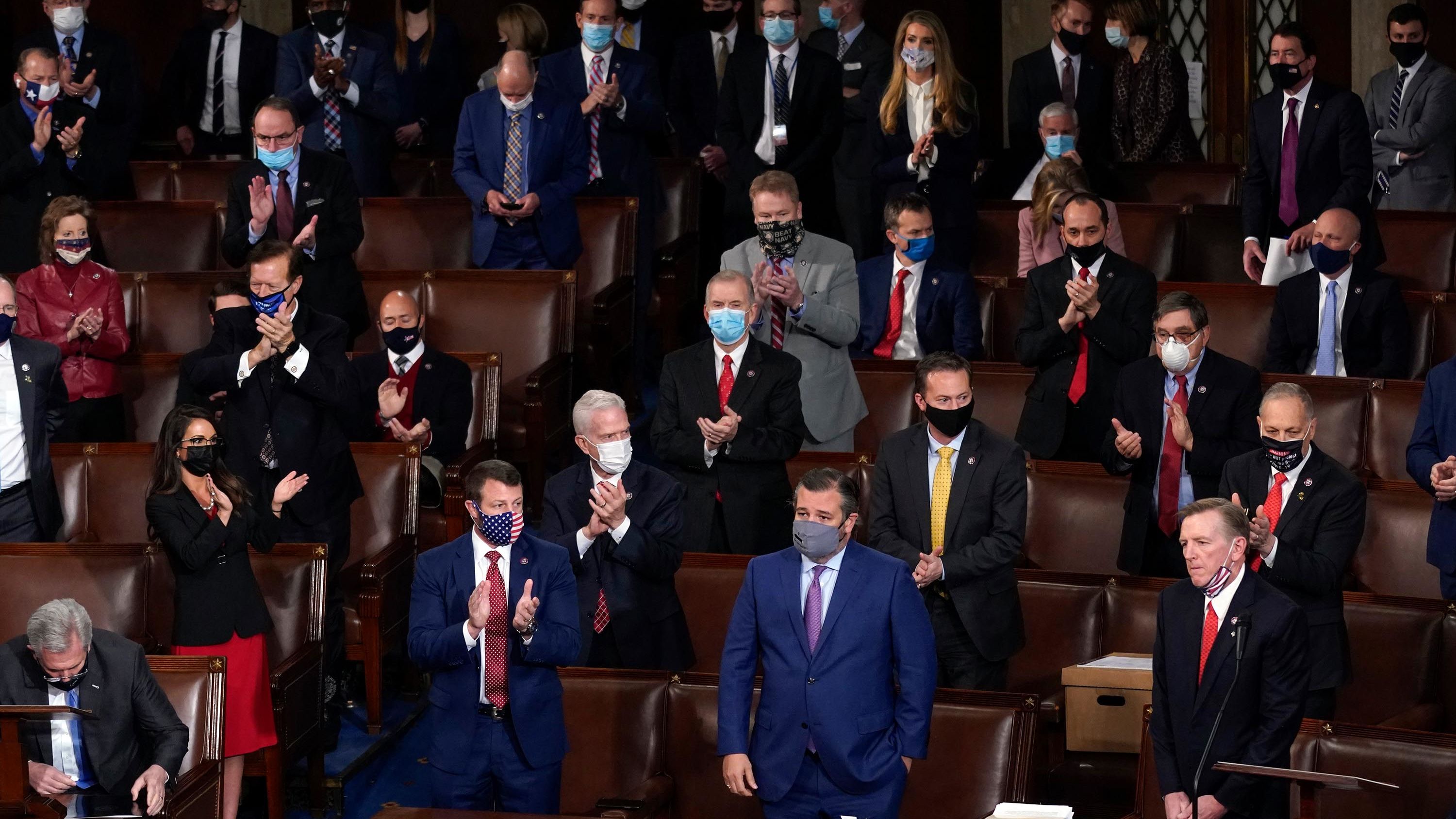Republicans applaud after US Rep. Paul Gosar, lower right, objected to certifying the Electoral College votes from Arizona. The Senate voted 93-6, however, <a href="https://www.cnn.com/2021/01/06/politics/2020-election-congress-electoral-college-vote-count/index.html" target="_blank">to dismiss the objection,</a> and it voted 92-7 to reject an objection to Pennsylvania's votes. In the House, a majority of Republicans voted to object to the results, but they were still soundly rejected: 303-121 for Arizona and 282-138 for Pennsylvania.