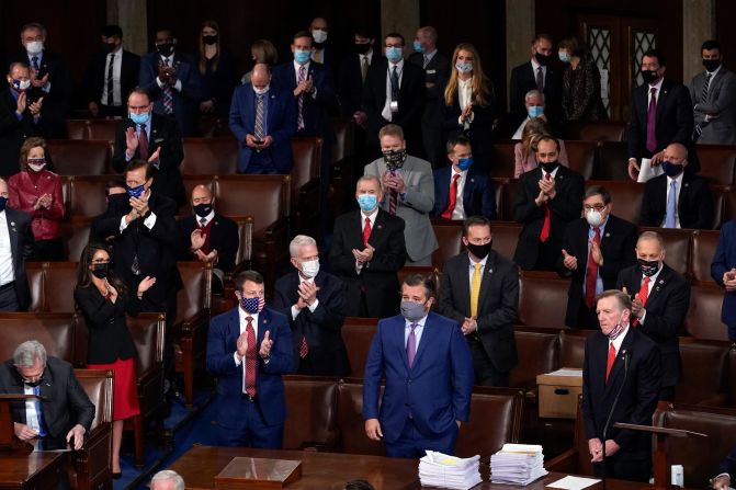 Republicans applaud after US Rep. Paul Gosar, lower right, objected to certifying the Electoral College votes from Arizona. The Senate voted 93-6, however, <a href="index.php?page=&url=https%3A%2F%2Fwww.cnn.com%2F2021%2F01%2F06%2Fpolitics%2F2020-election-congress-electoral-college-vote-count%2Findex.html" target="_blank">to dismiss the objection,</a> and it voted 92-7 to reject an objection to Pennsylvania's votes. In the House, a majority of Republicans voted to object to the results, but they were still soundly rejected: 303-121 for Arizona and 282-138 for Pennsylvania.