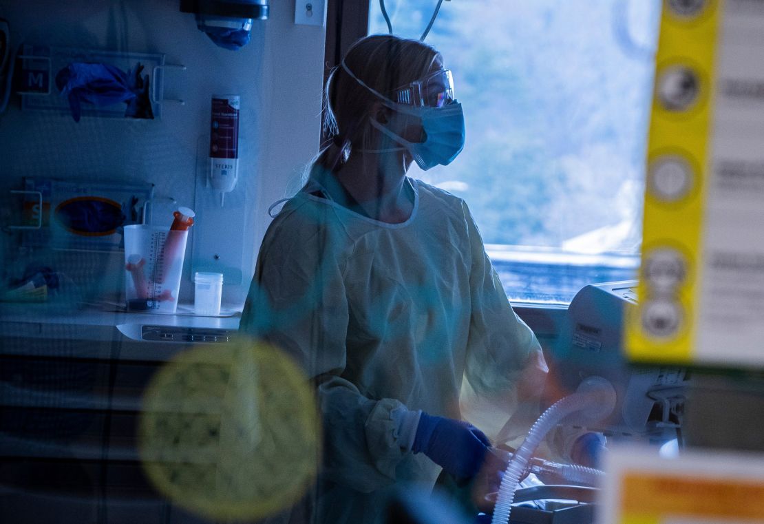 A nurse at the University of Vermont Medical Center Pediatric Intensive Care Unit cares for a pediatric Covid-19 patient.