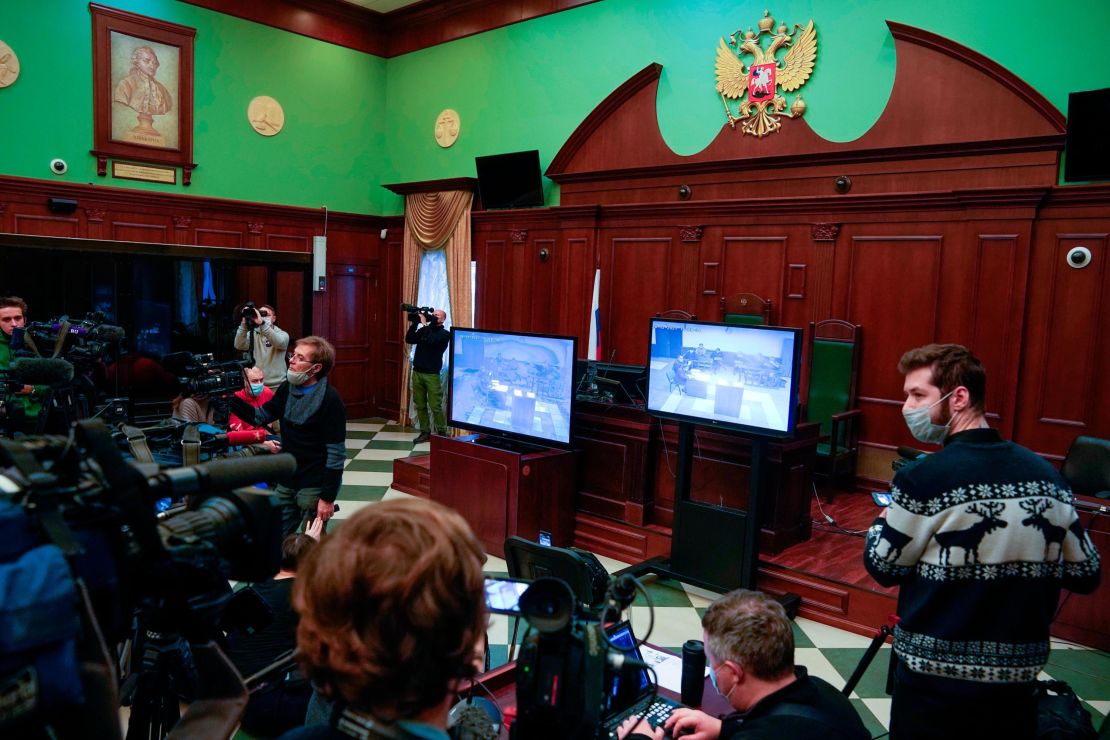 Journalists watch television coverage of Wednesday's hearing.