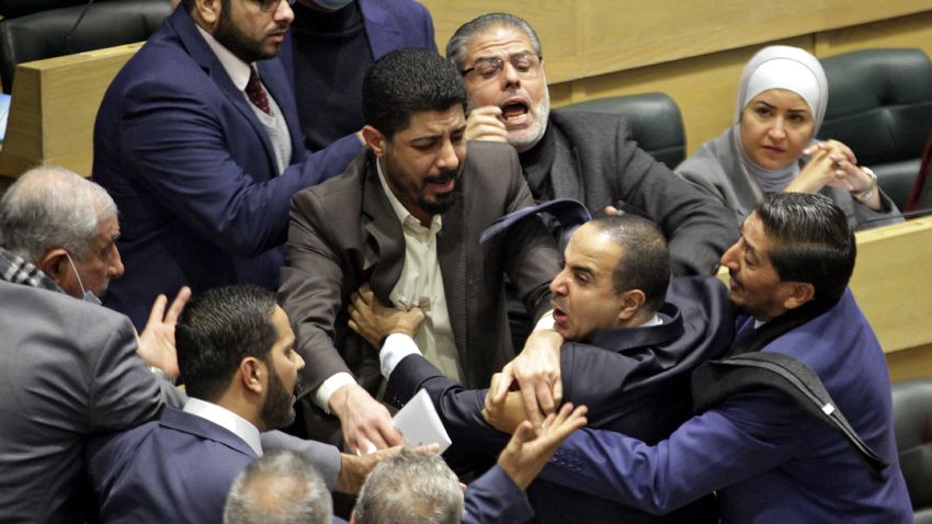 Jordanian parliament members are separated during an altercation in the parliament in the capital Amman on December 28, 2021.