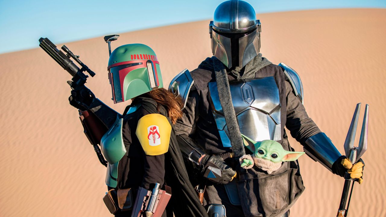 WINTERHAVEN, CALIFORNIA - FEBRUARY 21: Star Wars cosplayers Lisa Lower as Boba Fett (L) and Shawn Richter as Din Djarin pose for photos at Buttercup Sand Dunes on February 21, 2021 in Winterhaven, California. (Photo by Daniel Knighton/Getty Images)