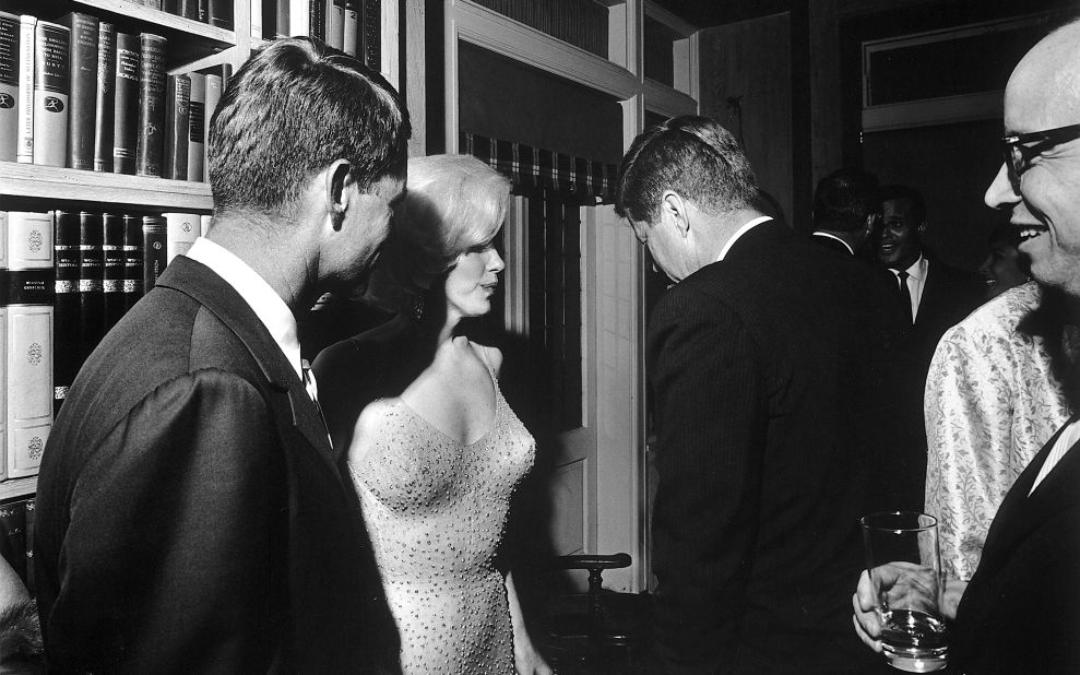 President John F. Kennedy (with his back to the camera), US Attorney General Robert Kennedy (far left), and Monroe on the President's 45th birthday. Monroe flew to New York to sing him a very erotic version of 