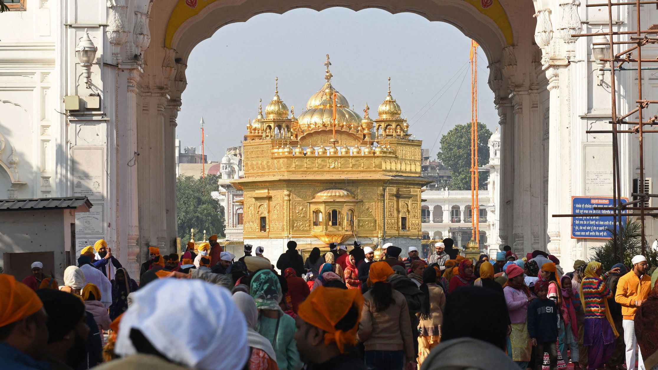 Sikh devotees arrive to pay respect at the Golden Temple in Amritsar on December 19, 2021, one day after a man was beaten to death for alleged sacrilege. 