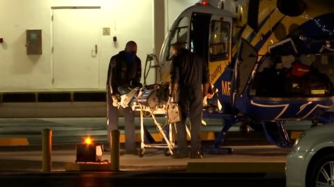 First responders transport River Rosenquist on a stretcher Wednesday.