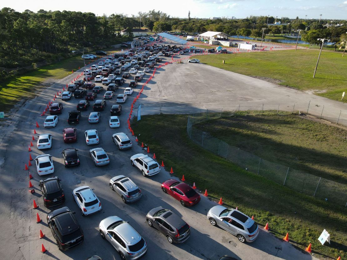 Cars wait in long lines at a drive-up Covid-19 testing center Wednesday at Tropical Park in Miami. 