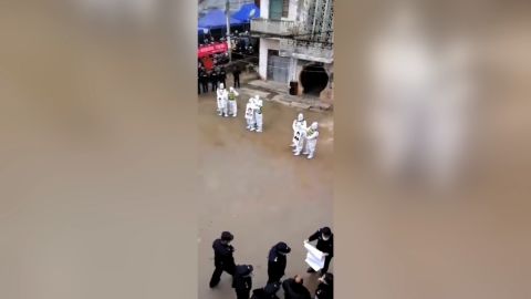 Chinese police parade alleged people smugglers for violating pandemic rules.