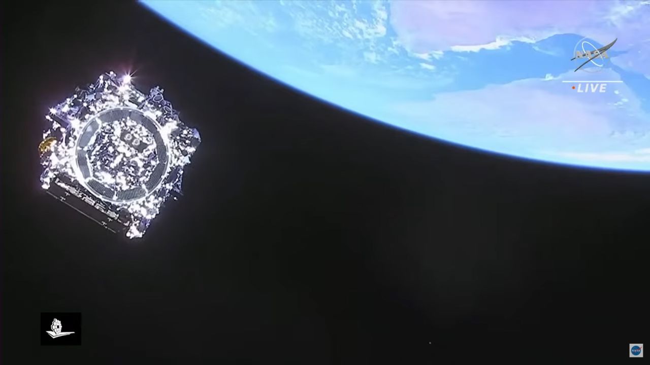 This image shows NASA's last look at the telescope after launch, captured by the cameras aboard the rocket's upper stage as the telescope separated from it. Earth can be seen to the upper right.