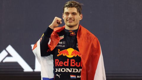 Max Verstappen celebrates on the podium after winning his maiden world title. 