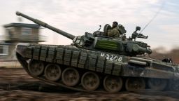 A Russian tank rolls during a military drills at Molkino training ground in the Krasnodar region, Russia, Tuesday, Dec. 14, 2021. Russia on Tuesday carried out military exercises in the Rostov region near its border with Ukraine. Tensions between the two countries rose in recent weeks amid reports of a Russian troop buildup near the border that stoked fears of a possible invasion -- allegations Moscow denied and in turn blamed Ukraine for its own military buildup in the east of the country. (AP Photo)
