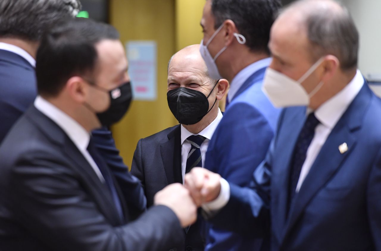 German Chancellor Olaf Scholz, center, attends a round table as Georgia's Prime Minister Irakli Garibashvili, left, greets Ireland's Prime Minister Micheal Martin, right, at an Eastern Partnership Summit in Brussels with the Russian military buildup on Ukraine's border as the main point of focus on Wednesday, December 15.