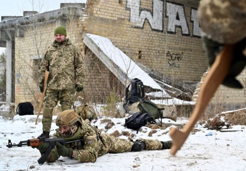 Ukrainian Territorial Defense Forces, the military reserve of the Ukrainian Armed Forces, holding wooden replicas of Kalashnikov rifles, take part in a military exercise near Kiev on December 25.