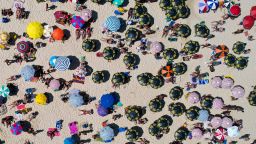 In an aerial view, people are seen  at Ipanema Beach on December 26, 2021 in Rio de Janeiro, Brazil.   Brazil's beaches are crowded with the arrival of summer despite the worldwide spread of the Omicron COVID-19 variant. The City Hall will hold a New Year's Eve party on the Copacabana shore, taking on the risks of the new variant. 