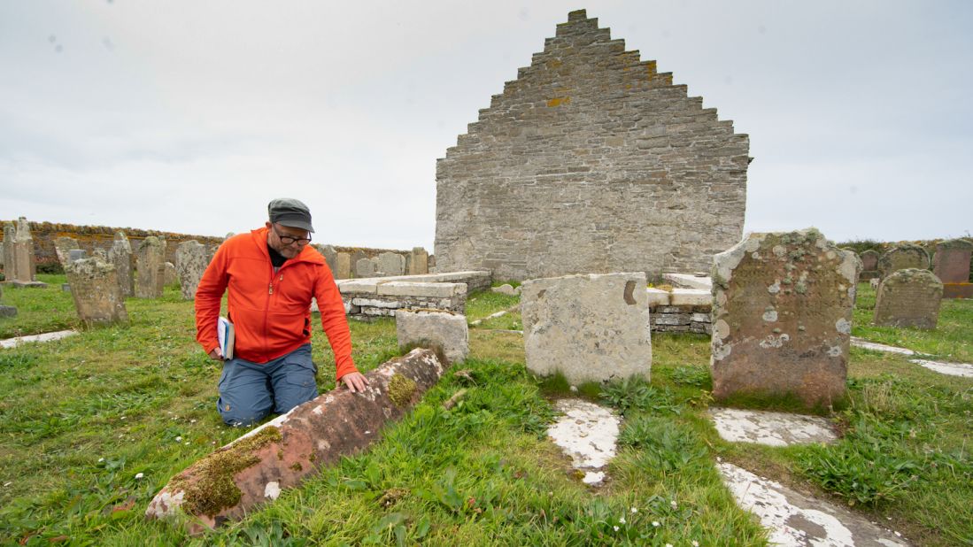 <strong>Mysterious grave:</strong> Papay Ranger Jonathan Ford says theories about an unusual tombstone in the church's graveyard may indicate nobility or, possibly, a witch.  