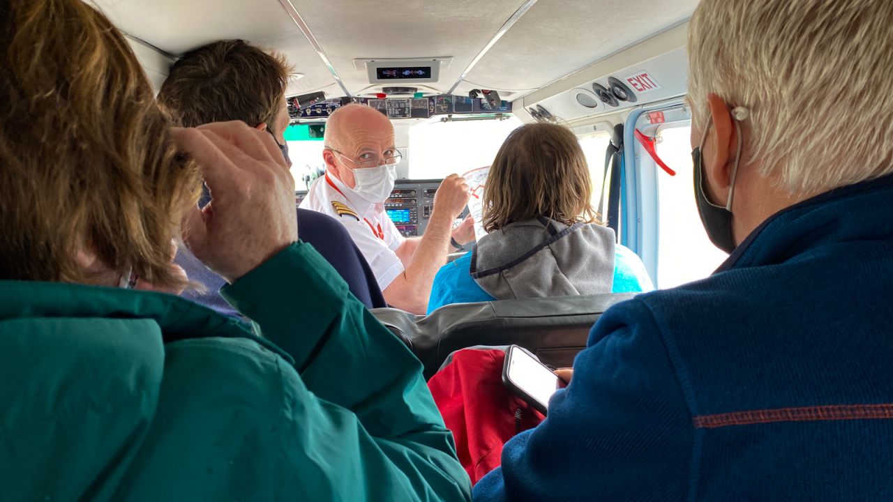 <strong>Safety briefing:</strong> Senior pilot Colin McAlister gives an over-the-shoulder safety briefing to his passengers. 