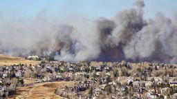 Dec 30, 2021; Superior, CO, USA; Smoke fills the air over the suburb of Superior, Colorado, as a wind-driven wildfire forced evacuations on Thursday afternoon. Mandatory Credit: Trevor Hughes-USA TODAY NETWORK