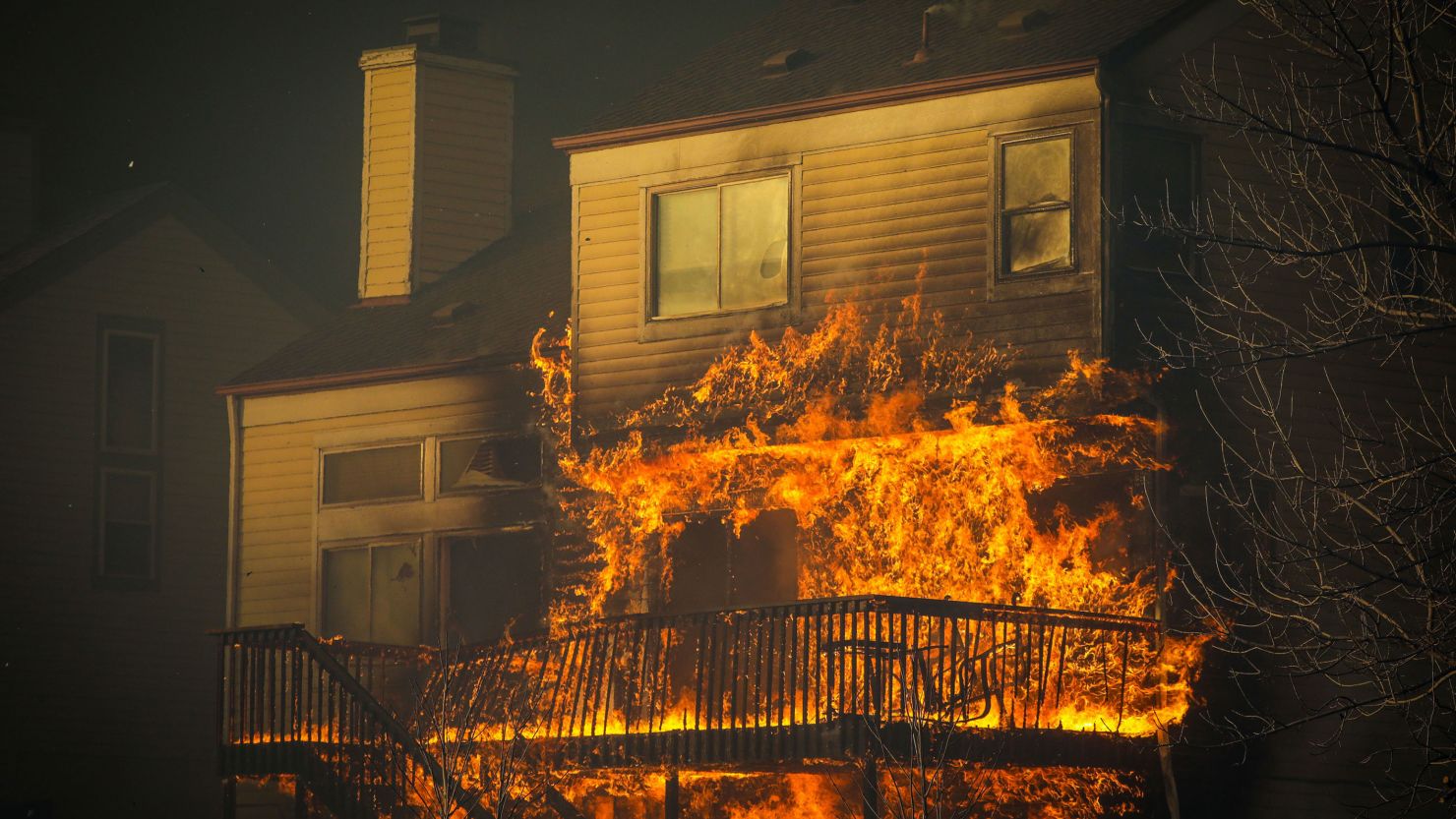 Flames overtake a family's home in Louisville, Colorado. 