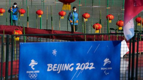 Workers prepare the ice surface for winter activities on New Year's Eve in Beijing, China, on December 31, 2021.