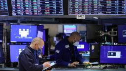 Traders work on the trading floor at the New York Stock Exchange (NYSE) in Manhattan, on December 28, 2021.