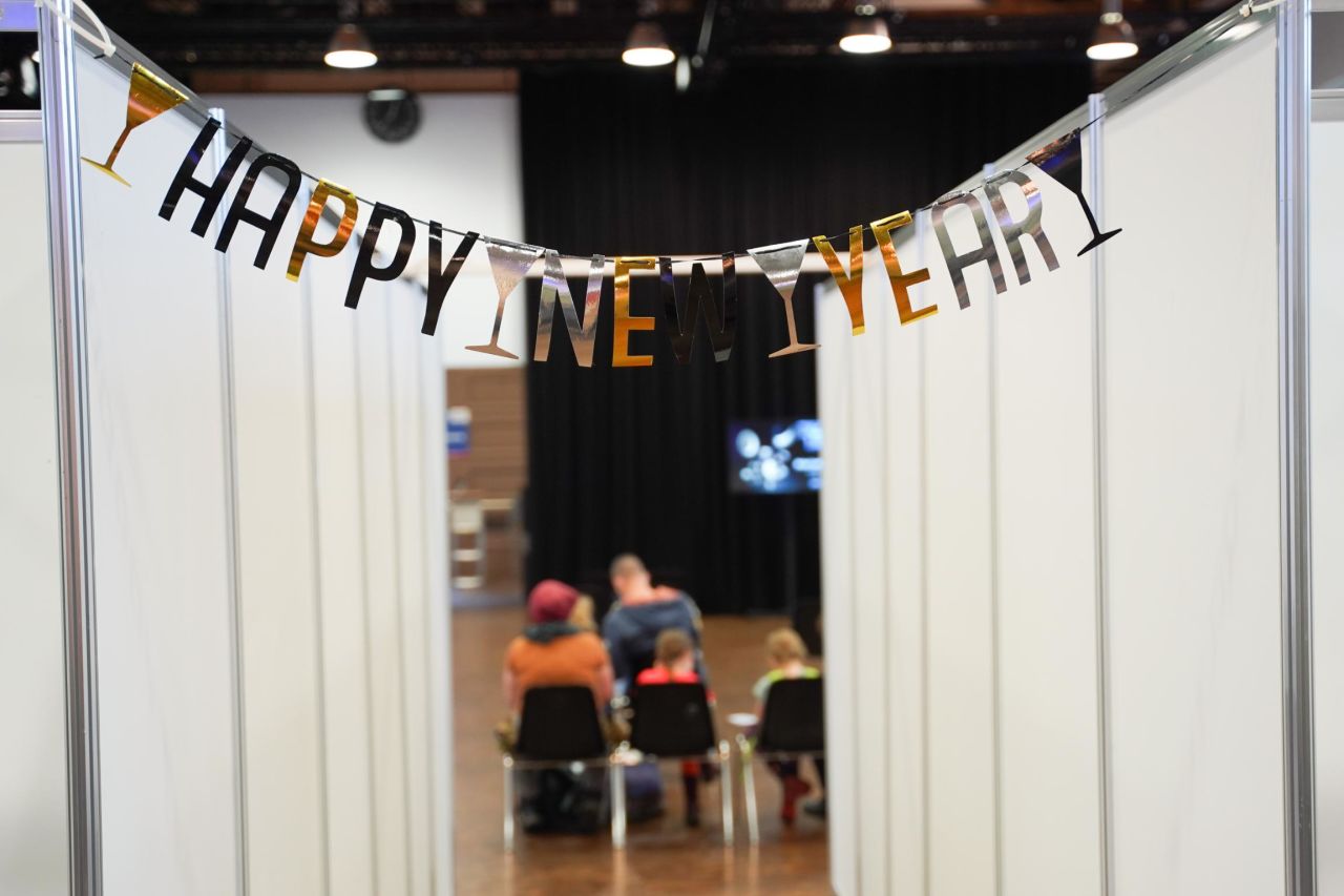 A garland with the slogan "Happy New Year" hangs at a vaccination center in Potsdam, Germany.