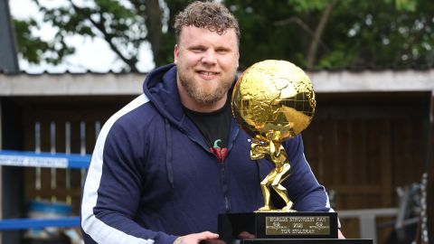 The 'World's Strongest Man,' Tom Stoltman, back home at his gym in Scotland with the trophy.