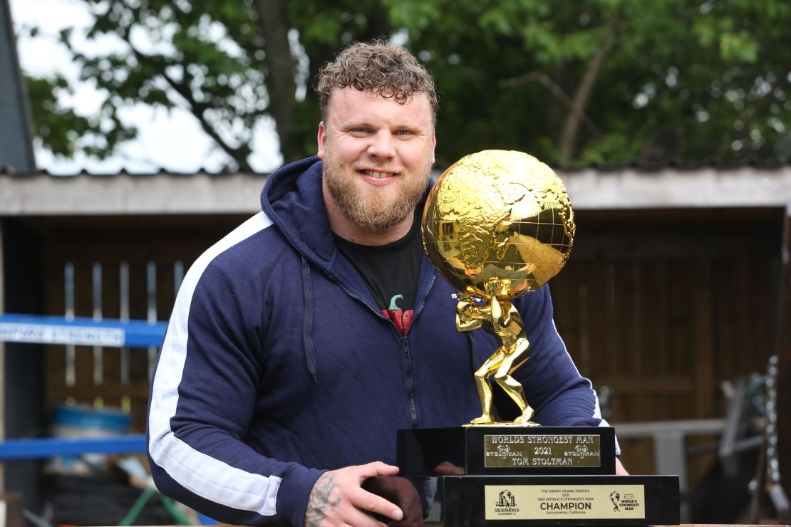 The 'World's Strongest Man,' Tom Stoltman, back home at his gym in Scotland with the trophy.