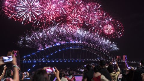 Fireworks light up the sky over Sydney Harbour as the clock strikes midnight on January 1, 2022 in Sydney, Australia.   New Year&#8217;s Eve countdowns around the world 211231133257 03 nye sydney 010122