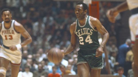 Sam Jones of the Boston Celtics dribbles the ball up court against the Philadelphia 76ers during an NBA game circa 1965 at Convention Hall in Philadelphia.