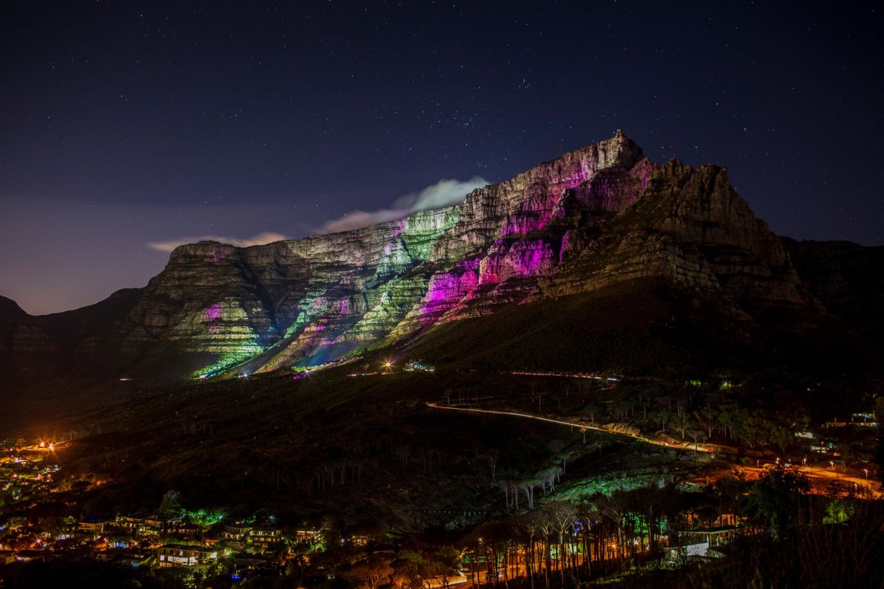 Table Mountain is lit with purple lights to honor the life of archbishop Desmond Tutu on December 30 in Cape Town, South Africa. 