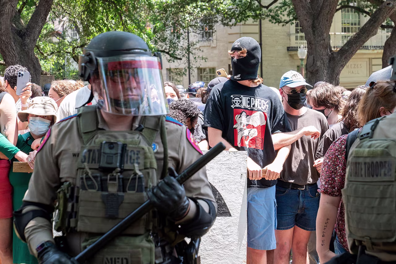 A Texas State trooper stands gurad near pro-Palestinian demomstrators at the University of Texas in Austin, Texas, on April 29.
