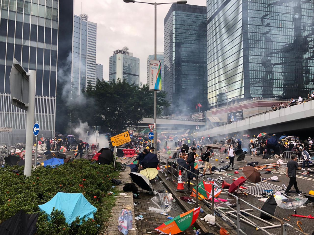 Tear gas can be seen on Harcourt Road, near to the Legislative Council building.