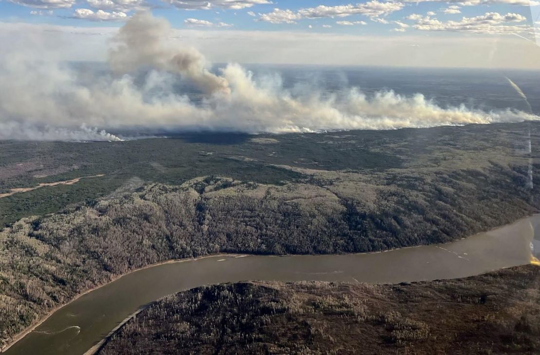 This handout picture courtesy of the Alberta Wildfire Service, taken May 11, 2024, shows smoke from wildfires burning southwest of the town of Fort McMurray, in Alberta, Canada.