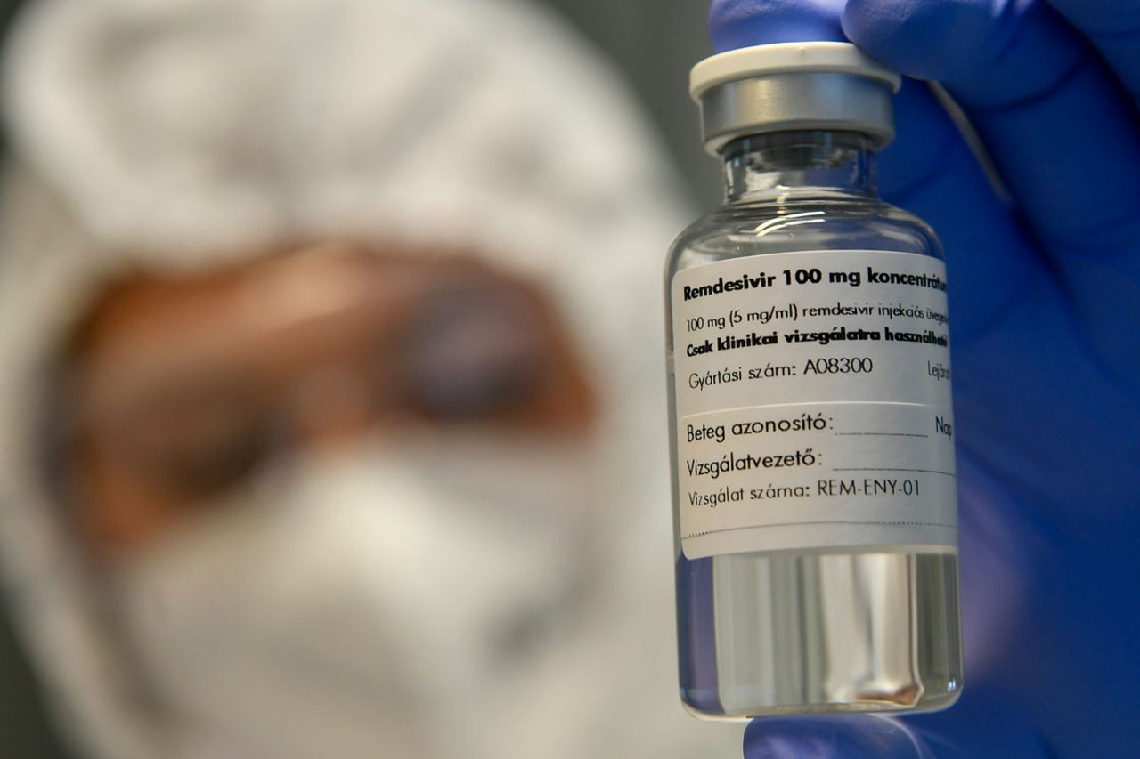 A bottle containing the drug Remdesivir is held by a health worker at the Institute of Infectology of Kenezy Gyula Teaching Hospital of the University of Debrecen in Debrecen, Hungary, on October 15.