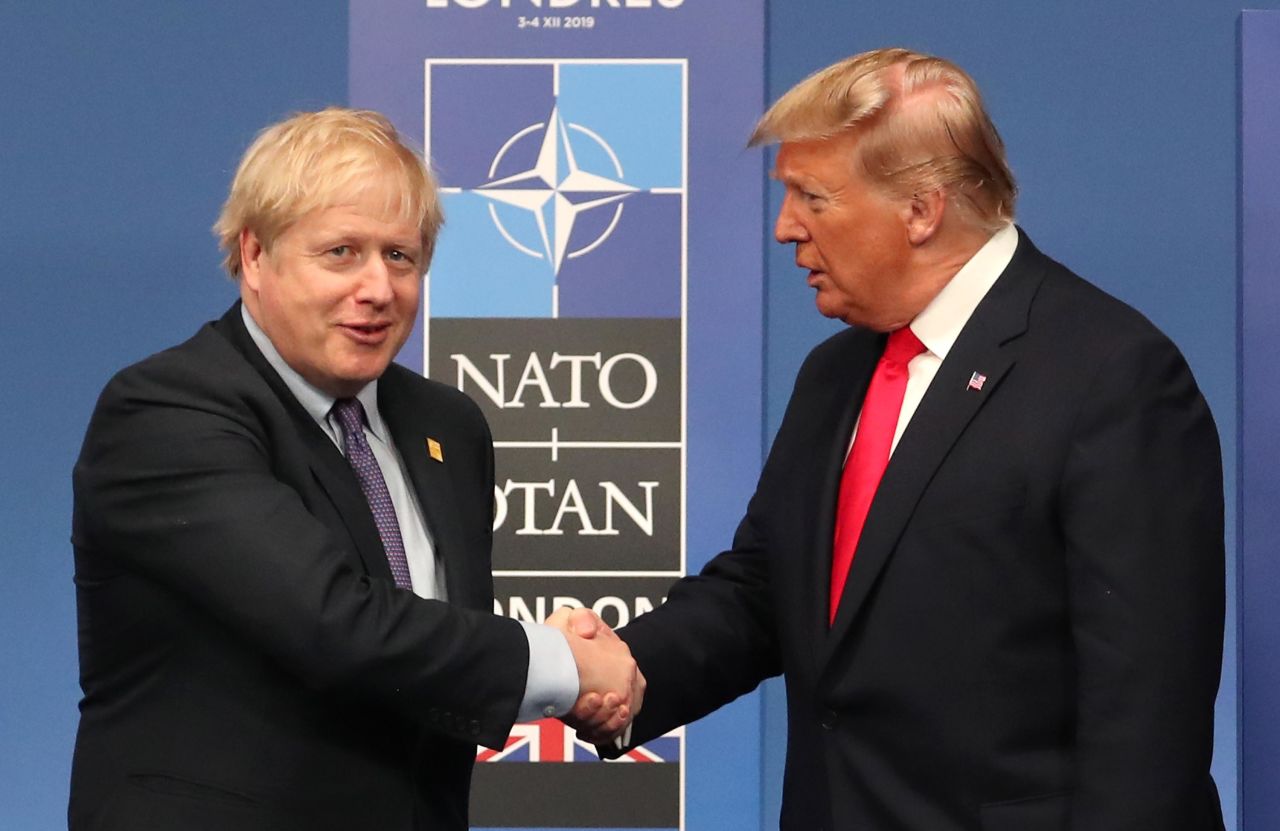 British Prime Minister Boris Johnson shakes hands with US President Donald Trump during the NATO heads of government summit on December 4, in Watford, England. Photo: Steve Parsons/WPA Pool/Getty Images