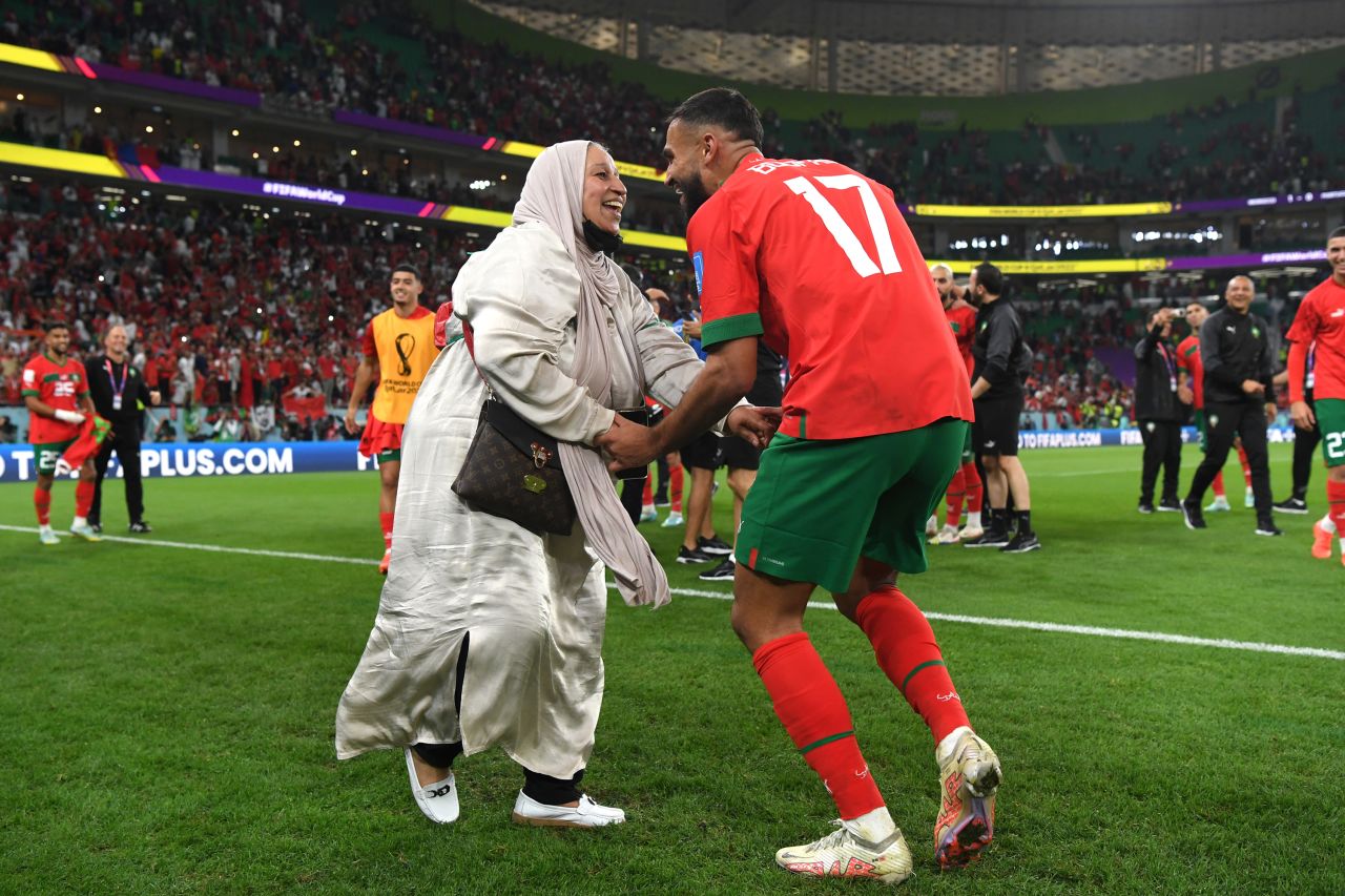 Sofiane Boufal of Morocco celebrates with a family member after the team's 1-0 victory against Portugal at Al Thumama Stadium in Doha, Qatar on December 10.