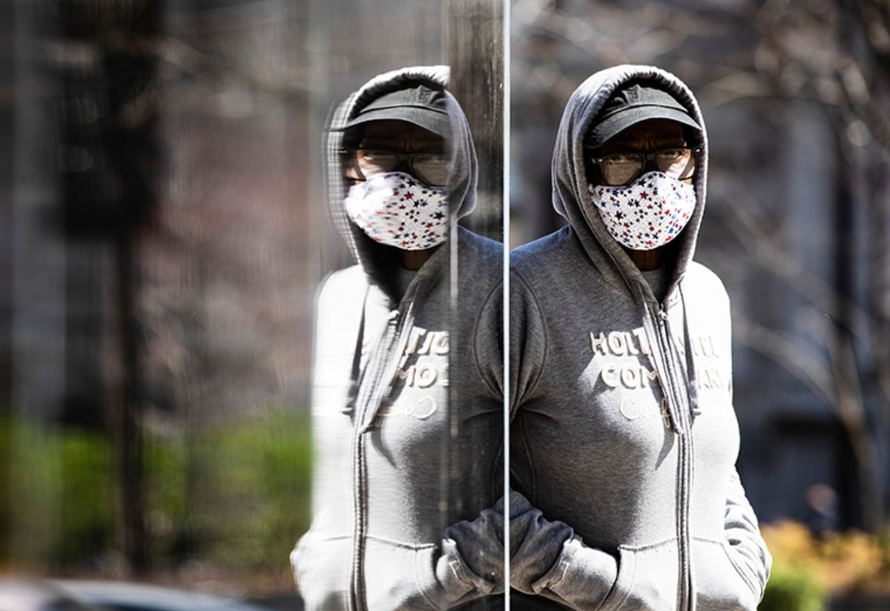 A person wearing a protective mask walks in Philadelphia, Thursday, April 2. (