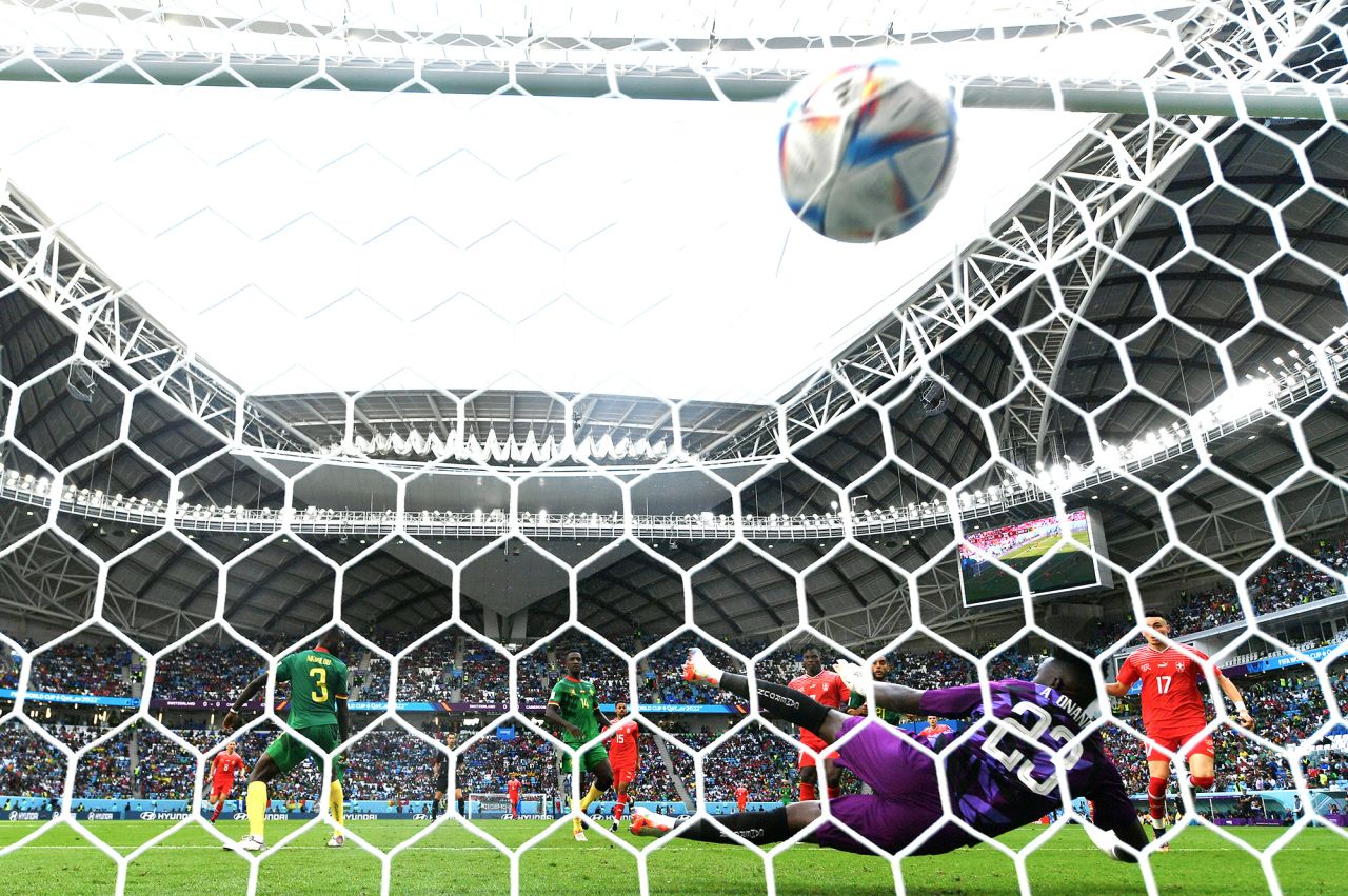 Breel Embolo of Switzerland scores their team's first goal past Andre Onana of Cameroon during the FIFA World Cup Qatar 2022 Group G match between Switzerland and Cameroon at Al Janoub Stadium on November 24, in Al Wakrah, Qatar. 