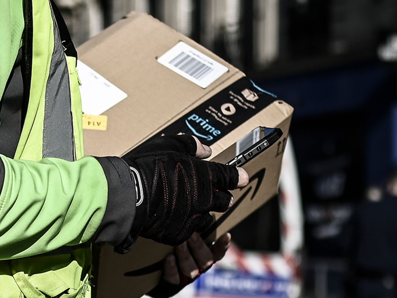 A delivery man delivers an Amazon package in Paris on March 19