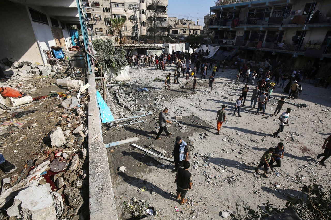 Palestinians inspect damage after an Israeli airstrike on a United Nations-run school in Deir El-Balah, Gaza, on June 6.