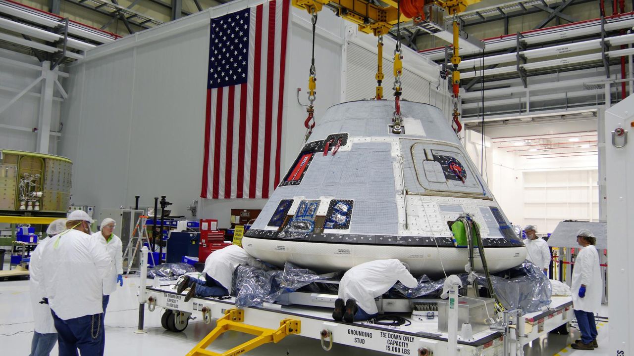 Technicians and engineers prepare Boeing's Starliner for transport to the company's testing facilities at Kennedy Space Center in Florida in November 2018.