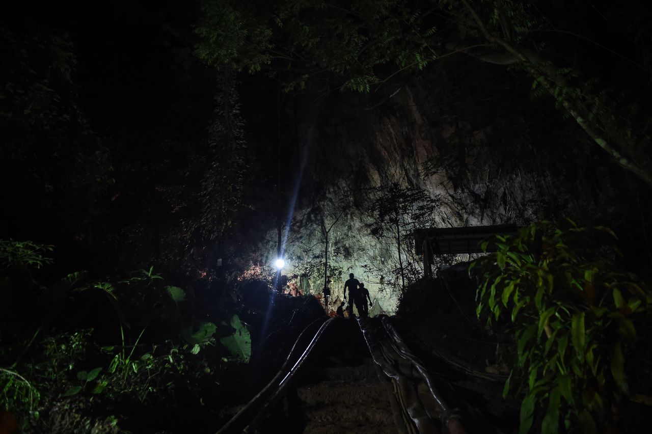 Thai soldiers emerge from the mouth of Tham Luang cave, at the Khun Nam Nang Non Forest Park in Chiang Rai province on July 2, 2018.