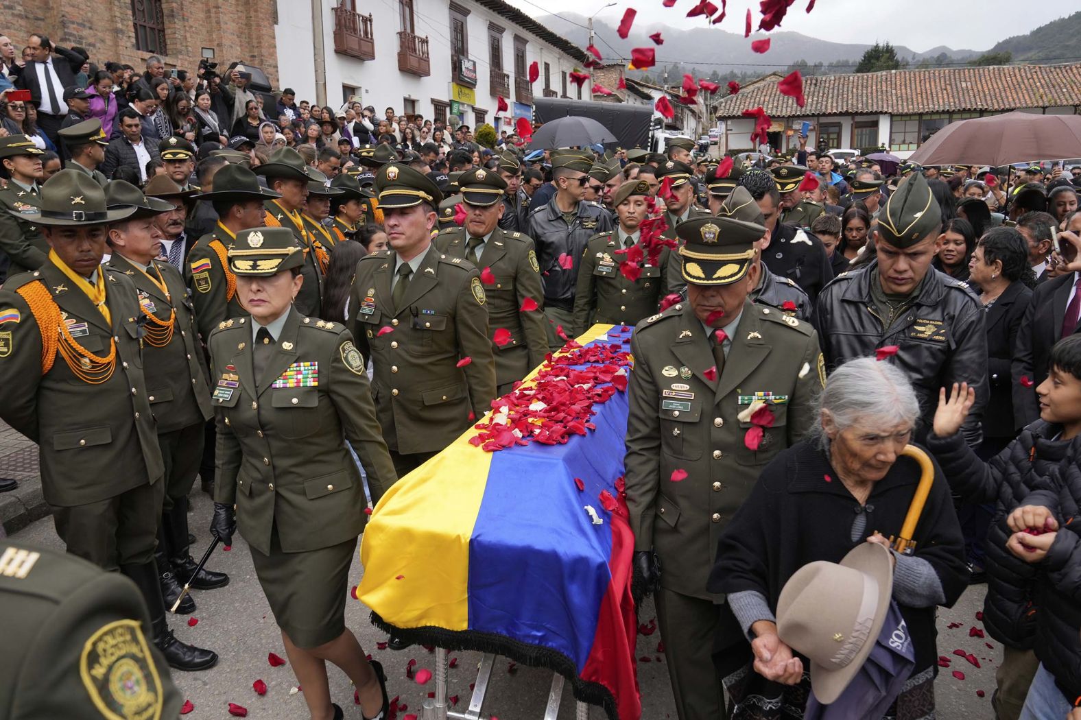 Police officers carry the coffin of Capt. Francisco Merchan after his funeral in Mongua, Colombia, on Monday, August 25. Merchan, a police pilot, was killed when his helicopter was shot down by a dissident faction of the former FARC guerrilla group.