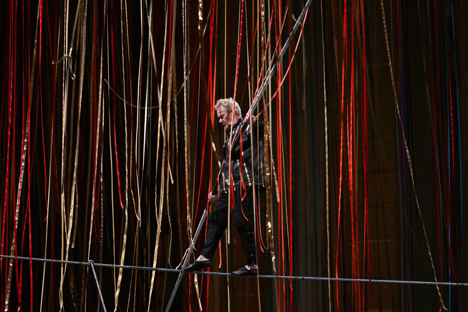 High-wire artist Philippe Petit performs "The Ribbon Walk" above an audience in New York on Thursday, February 1.