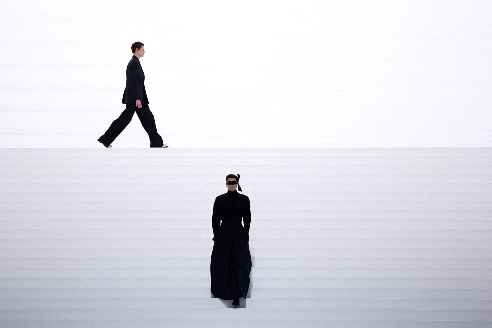 Models present creations by designer Kim Jones as part of his menswear collection show for fashion house Dior in Paris on Friday, January 24.