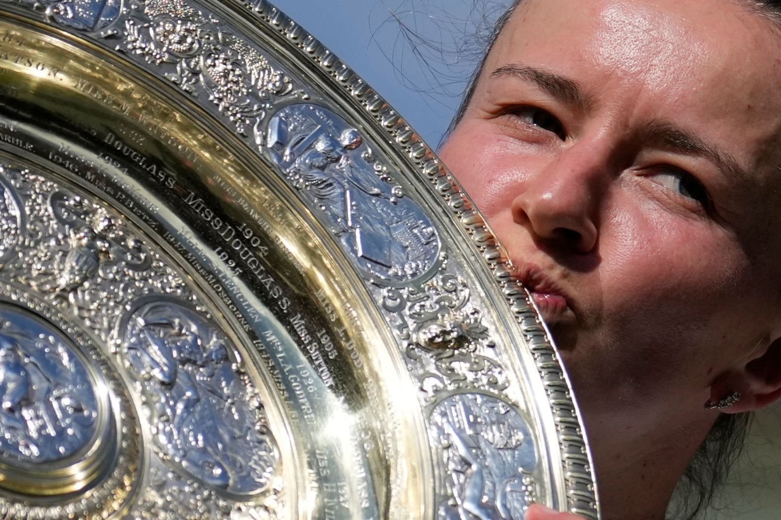 Barbora Krejčíková kisses the winners trophy after she <a href="index.php?page=&url=https%3A%2F%2Fwww.cnn.com%2F2024%2F07%2F13%2Fsport%2Fwimbledon-paolini-krejcikova-womens-final-spt-intl%2Findex.html">won her first Wimbledon title</a> on Saturday, July 13. Krejčíková overpowered Jasmine Paolini in three sets to win her second grand slam.