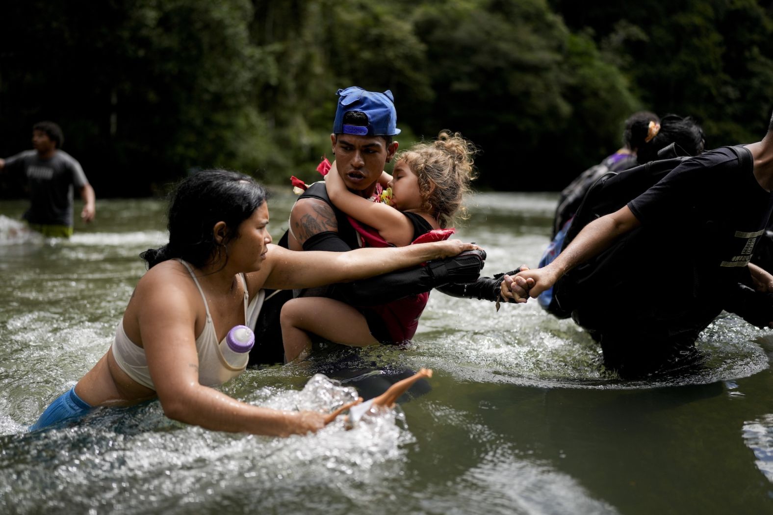 Venezuelan migrant Alvaro Calderini carries his niece across a river near Bajo Chiquito, Panama, on Saturday, November 9, after walking across <a href="index.php?page=&url=https%3A%2F%2Fwww.cnn.com%2F2024%2F07%2F01%2Famericas%2Fpanama-us-darien-migrants-agreement-intl-latam%2Findex.html">the treacherous Darién Gap</a>. The 66-mile hike through the mountainous rainforest region brings migrants from Colombia to Panama and is a crucial passage for those hoping to reach the United States and Canada.