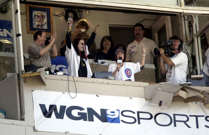 Osbourne and his wife, Sharon, sing “Take Me Out to the Ballgame” during a Chicago Cubs baseball game in 2003.