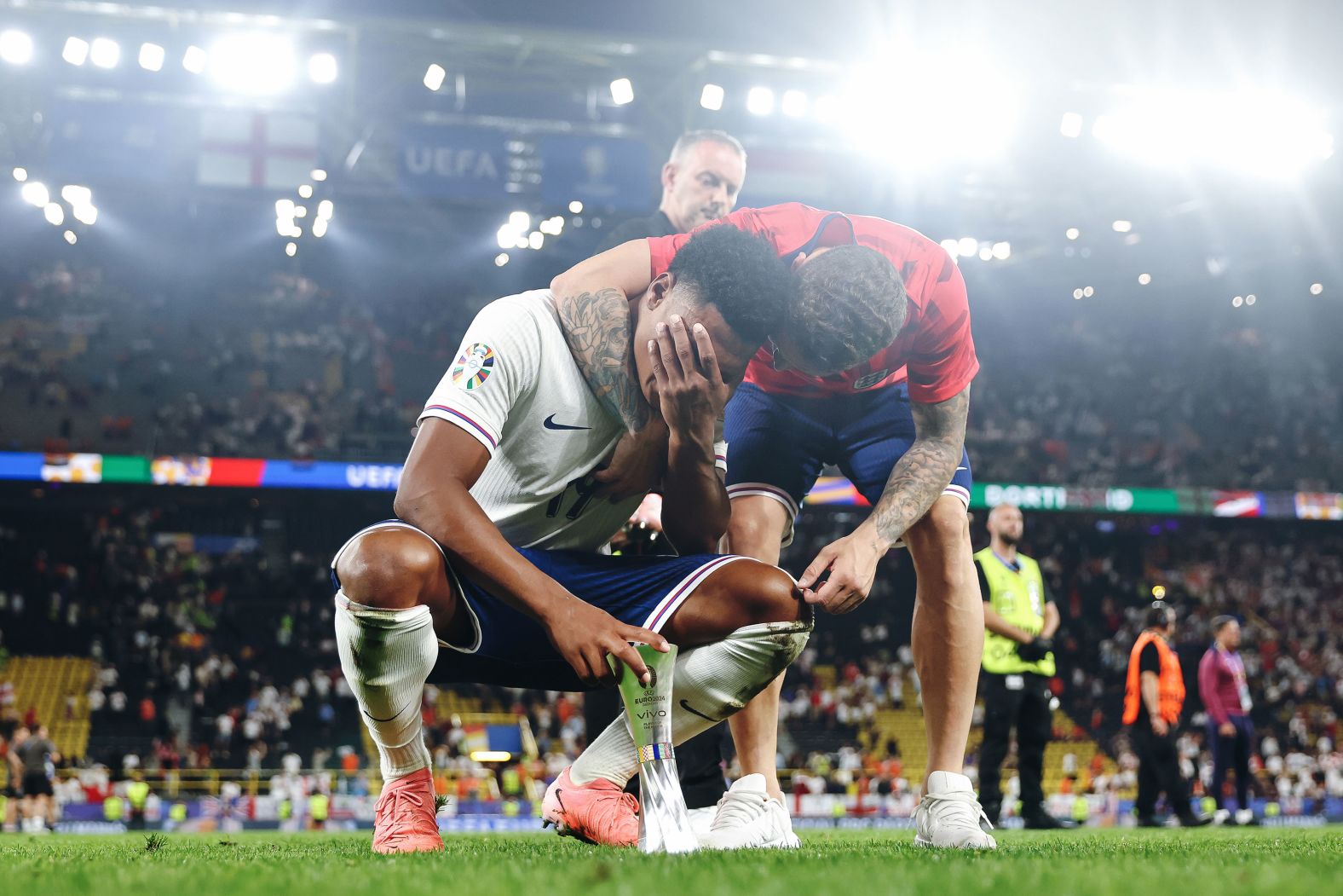 England forward Ollie Watkins, holding his Player of the Match award, is embraced by teammate Kieran Trippier after their <a href="index.php?page=&url=https%3A%2F%2Fwww.cnn.com%2F2024%2F07%2F10%2Fsport%2Fengland-netherlands-euro-2024-semifinals-spt-intl%2Findex.html">2-1 win over the Netherlands</a> in the Euro 2024 semifinals on Wednesday, July 10. Watkins, who came on as a substitute, scored the match-winning goal in added time.