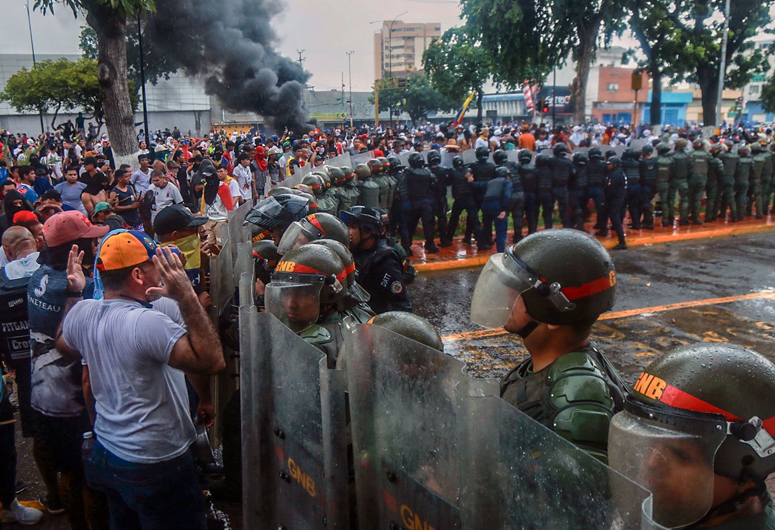 Demonstrators in Puerto La Cruz, Venezuela, confront police during a protest against the government of Venezuelan President Nicolas Maduro on Monday, July 29. <a href="index.php?page=&url=https%3A%2F%2Fwww.cnn.com%2F2024%2F07%2F29%2Famericas%2Fvenezuela-election-maduro-winner-intl-hnk%2Findex.html">Both Maduro and his political opponent claimed victory in the country’s election</a> on Monday, a vote that was marked by accusations of fraud and counting irregularities.
